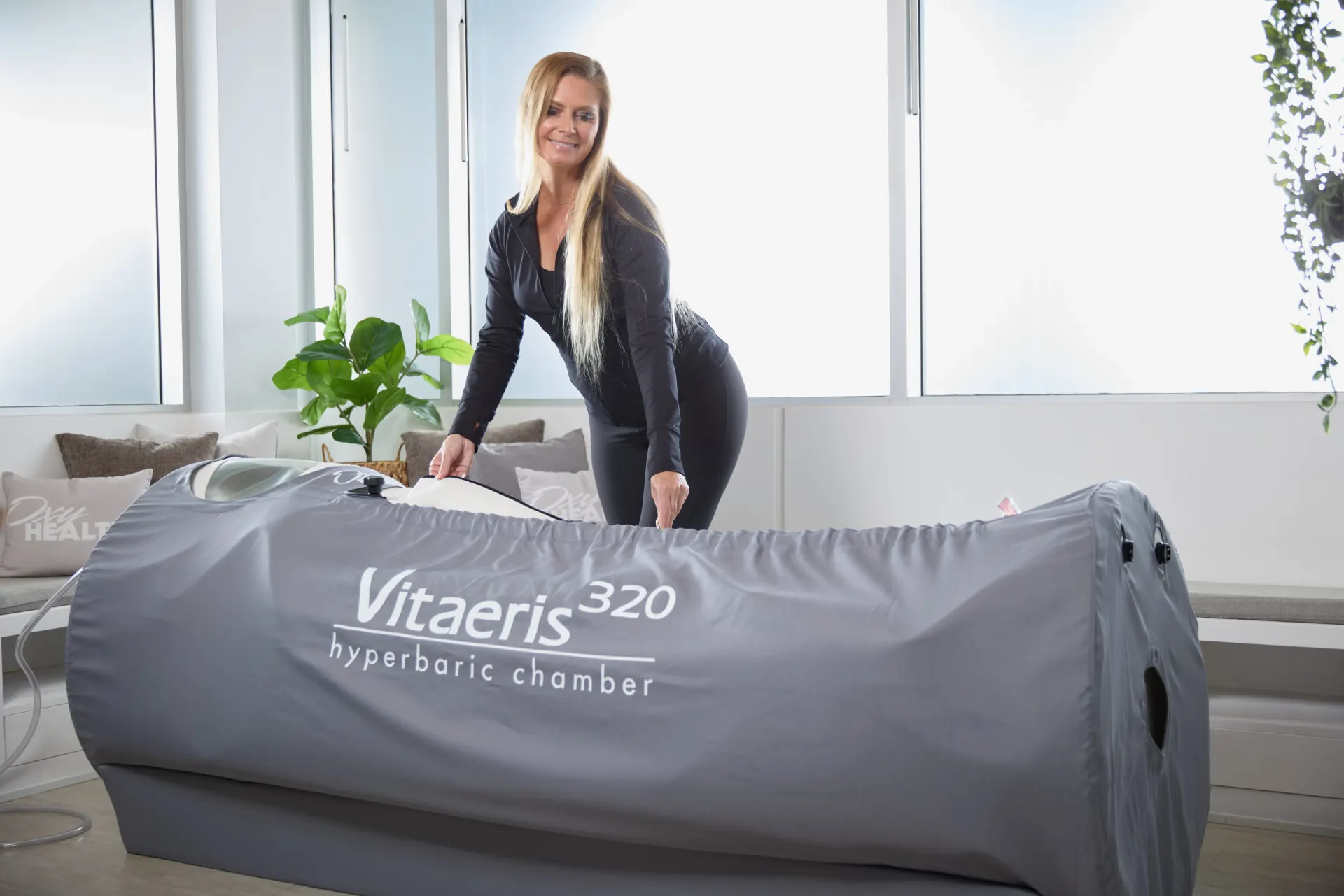 OxyHealth Vitaeris 320 portable soft-sided hyperbaric chamber in a bright room