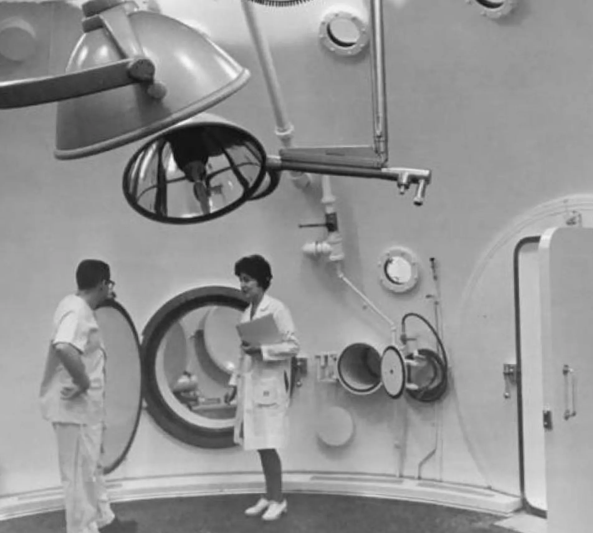Historical photograph of military hyperbaric chambers used to treat deep-sea divers with decompression sickness